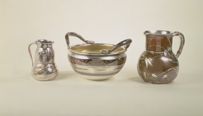 Left: water pitcher with pool scene; Centre: eight pint christening bowl; Right: jug of double gourd form, Tiffany and Co by Louis Comfort Tiffany